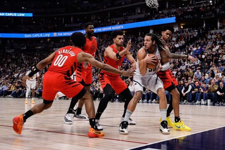 Portland Trail Blazers rookie Toumani Camara and teammates play defense