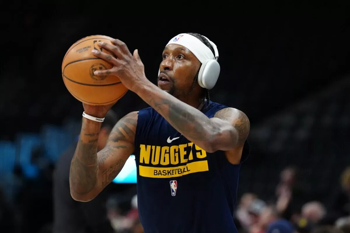 Feb 14, 2024; Denver, Colorado, USA; Denver Nuggets guard Kentavious Caldwell-Pope (5) warms up before the game against the Sacramento Kings at Ball Arena. Mandatory Credit: Ron Chenoy-USA TODAY Sports