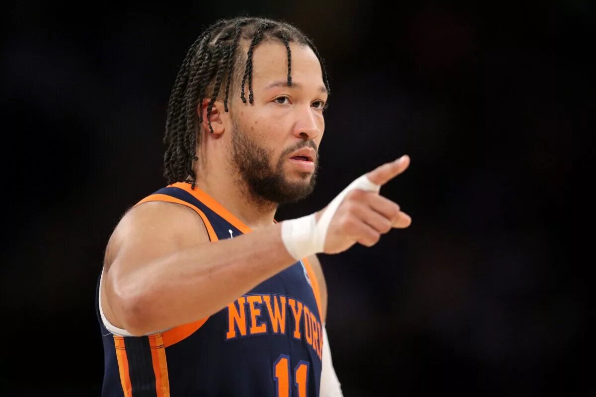 New York Knicks guard Jalen Brunson (11) points during the second quarter against the Detroit Pistons at Madison Square Garden.