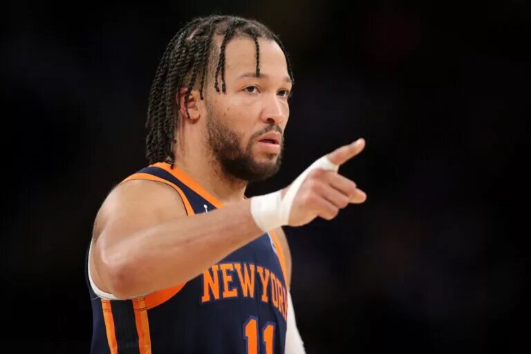 New York Knicks guard Jalen Brunson (11) points during the second quarter against the Detroit Pistons at Madison Square Garden.