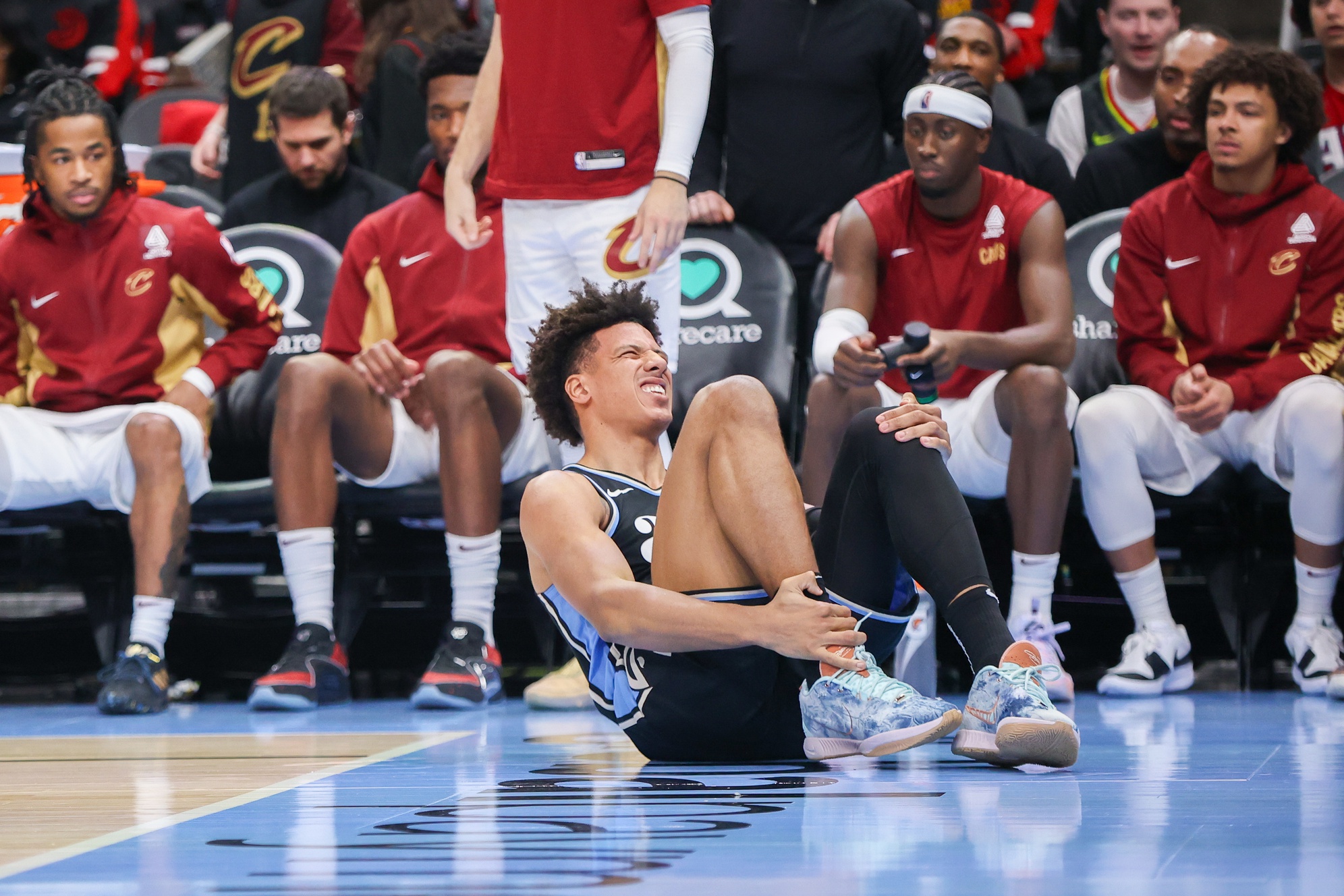 Atlanta Hawks forward Jalen Johnson (1) reacts after an ankle injury against the Cleveland Cavaliers in the second half at State Farm Arena.