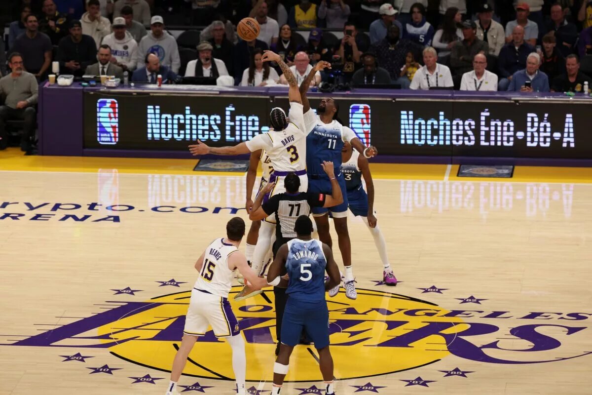 Mar 10, 2024; Los Angeles, California, USA; Los Angeles Lakers forward Anthony Davis (3) and Minnesota Timberwolves center Naz Reid (11) tip off during the first quarter at Crypto.com Arena. Mandatory Credit: Kiyoshi Mio-USA TODAY Sports