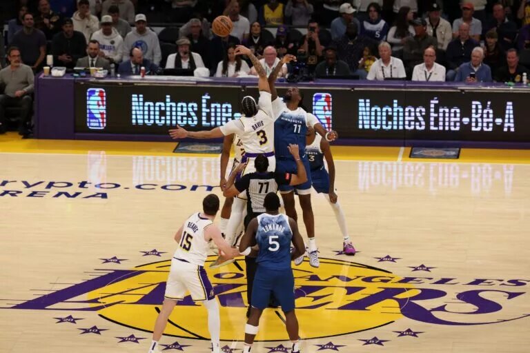 Mar 10, 2024; Los Angeles, California, USA; Los Angeles Lakers forward Anthony Davis (3) and Minnesota Timberwolves center Naz Reid (11) tip off during the first quarter at Crypto.com Arena. Mandatory Credit: Kiyoshi Mio-USA TODAY Sports
