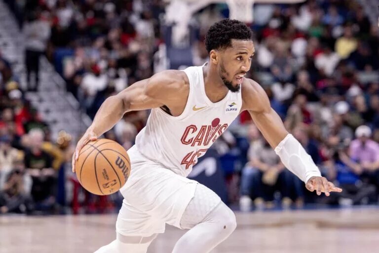 Mar 13, 2024; New Orleans, Louisiana, USA; Cleveland Cavaliers guard Donovan Mitchell (45) dribbles against the New Orleans Pelicans during the first half at Smoothie King Center. Mandatory Credit: Stephen Lew-USA TODAY Sports