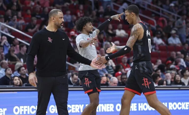 Houston Rockets coach Ime Udoka alongside Jabari Smith Jr. and Jalen Green