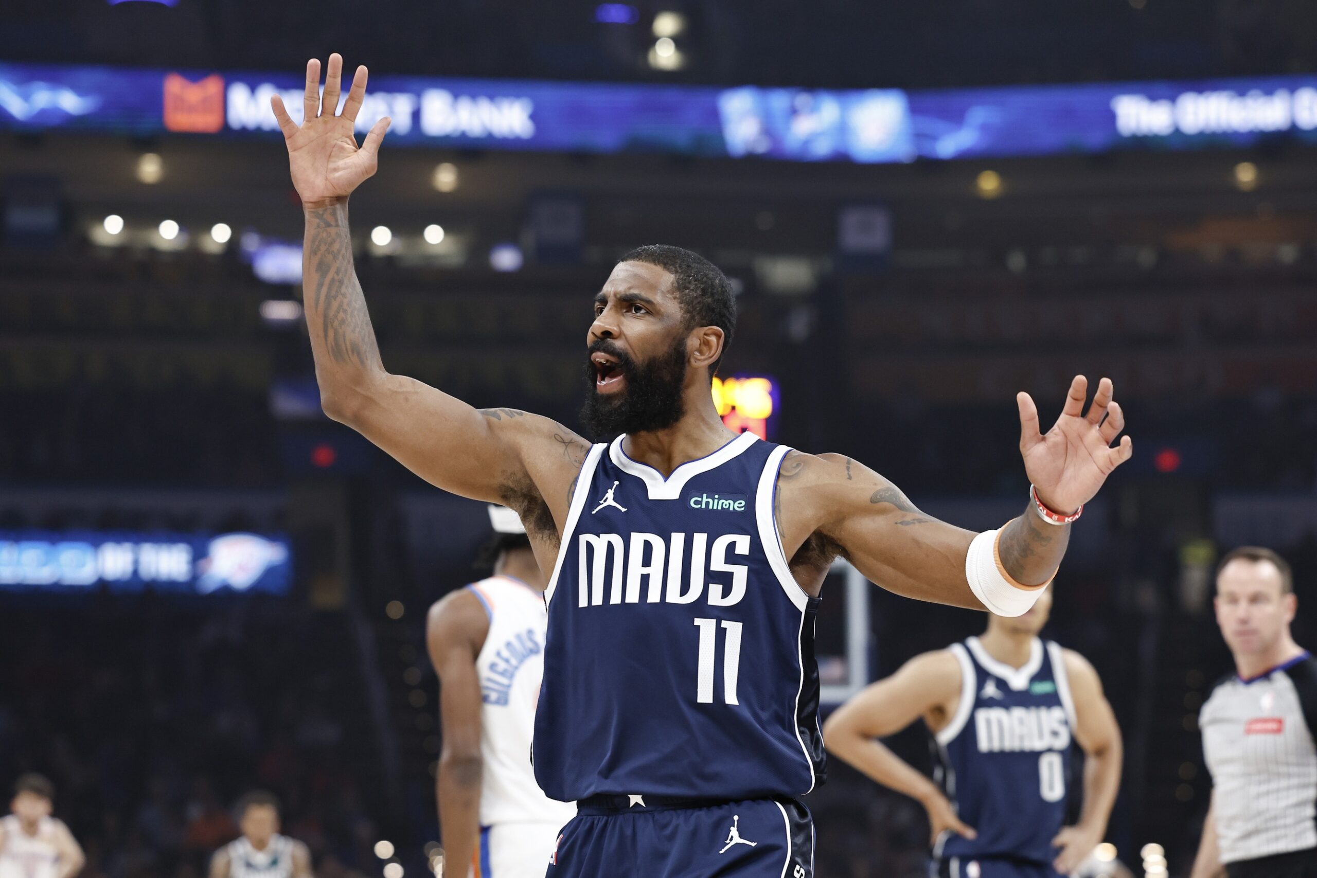 Dallas Mavericks guard Kyrie Irving (11) reacts after an officials call on a play against the Oklahoma City Thunder during the first quarter at Paycom Center.