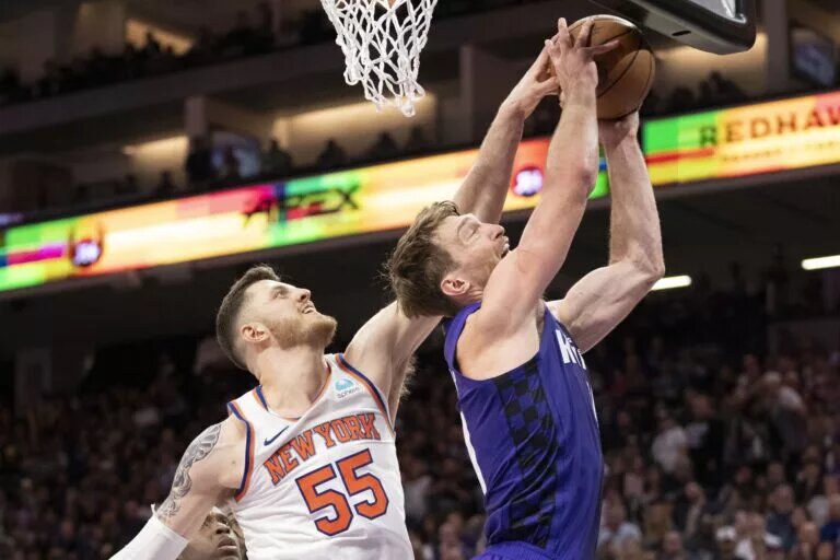 New York Knicks center Isaiah Hartenstein (55) blocks the shot attempt by Sacramento Kings forward Domantas Sabonis (10) during the fourth quarter at Golden 1 Center.