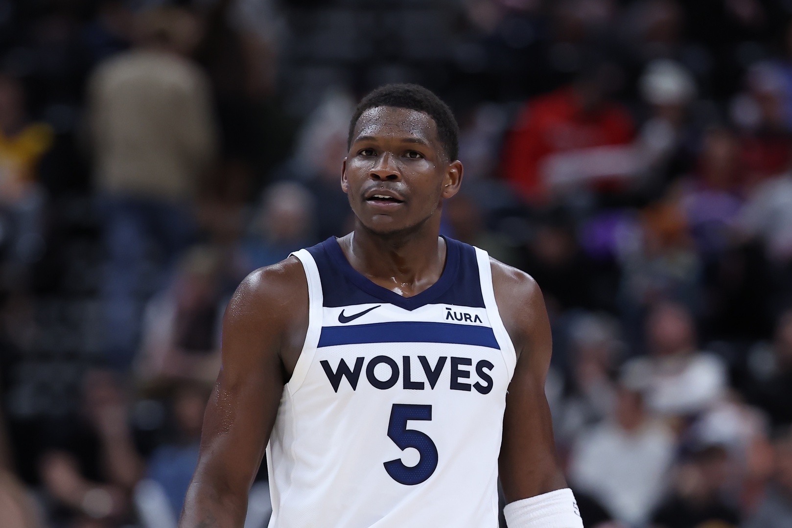 Minnesota Timberwolves guard Anthony Edwards (5) looks on against the Utah Jazz during the fourth quarter at Delta Center.