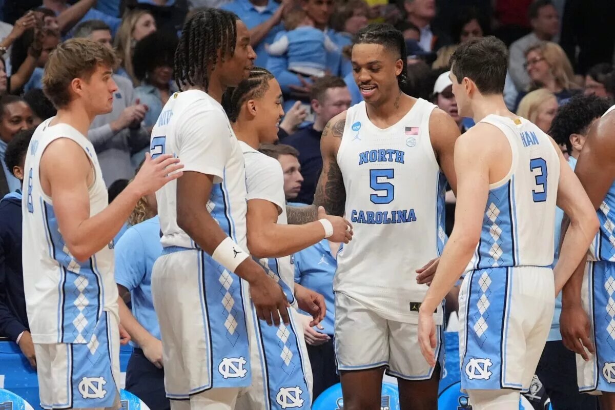 March 23, 2024, Charlotte, NC, USA; North Carolina Tar Heels forward Armando Bacot (5) celebrates with teammates against the Michigan State Spartans in the second round of the 2024 NCAA Tournament at the Spectrum Center. Mandatory Credit: Jim Dedmon-USA TODAY Sports