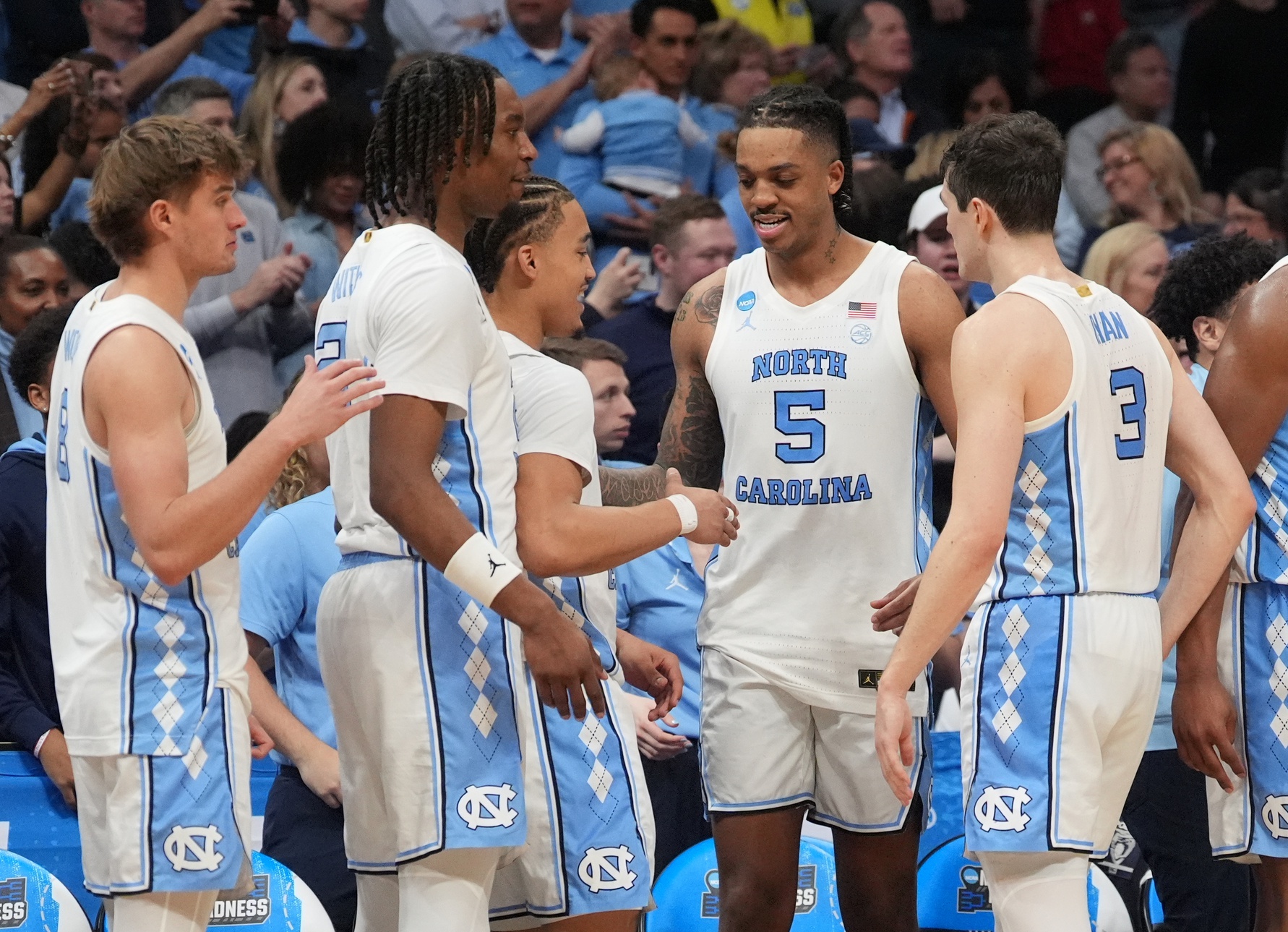 March 23, 2024, Charlotte, NC, USA; North Carolina Tar Heels forward Armando Bacot (5) celebrates with teammates against the Michigan State Spartans in the second round of the 2024 NCAA Tournament at the Spectrum Center. Mandatory Credit: Jim Dedmon-USA TODAY Sports