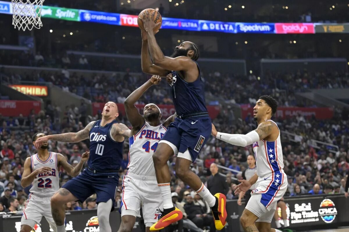 Los Angeles Clippers guard James Harden goes for layup against Philadelphia 76ers in first game since trade
