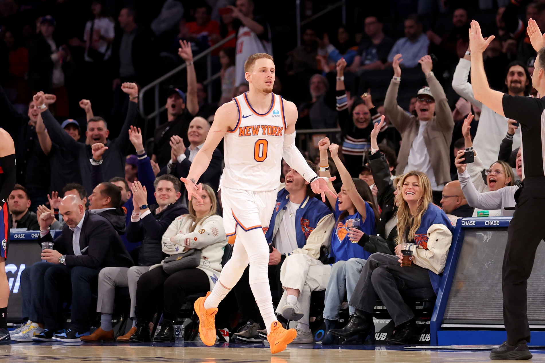 Mar 25, 2024; New York, New York, USA; New York Knicks guard Donte DiVincenzo (0) celebrates his three point shot against the Detroit Pistons during the fourth quarter at Madison Square Garden. Mandatory Credit: Brad Penner-USA TODAY Sports