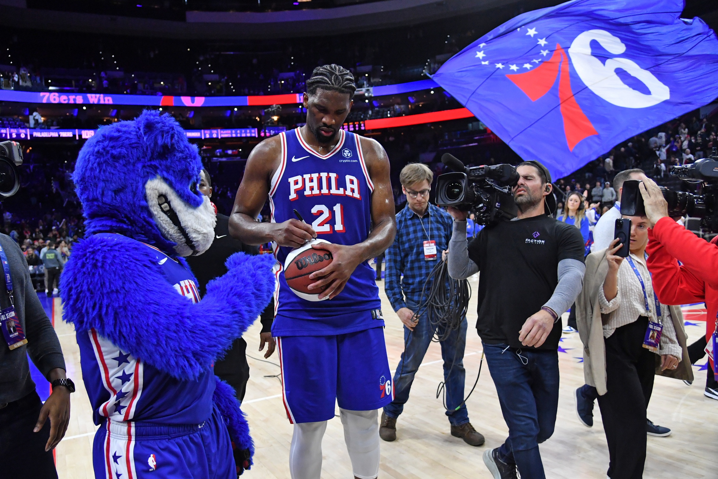 Philadelphia 76ers center Joel Embiid signs autograph after returning from injury