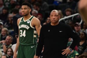 Milwaukee Bucks star Giannis Antetokounmpo beside head caoch Doc Rivers