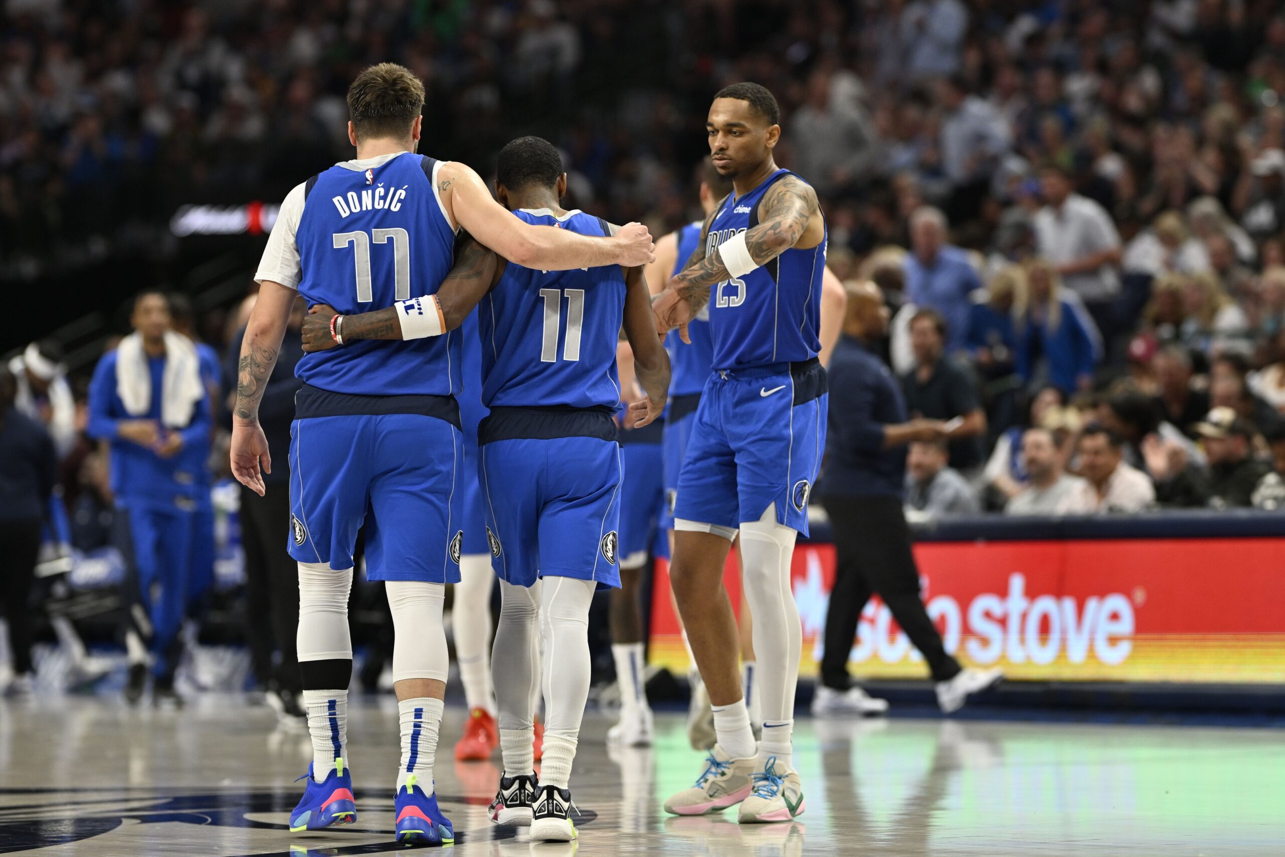 Dallas Mavericks guards Luka Doncic and Kyrie Irving embrace