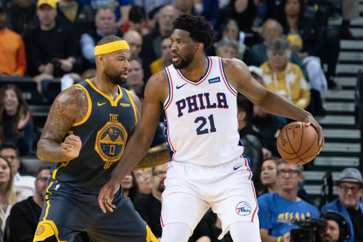 Former NBA star DeMarcus Cousins guards Philadelphia 76ers MVP Joel Embiid