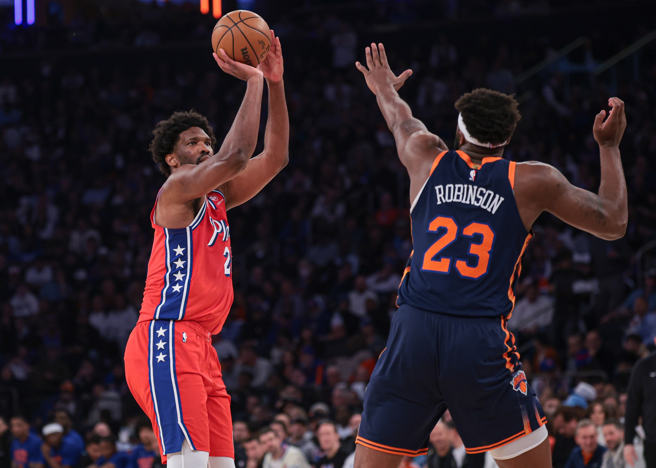 New York Knicks center Mitchell Robinson and Philadelphia 76ers center Joel Embiid, limited by injury