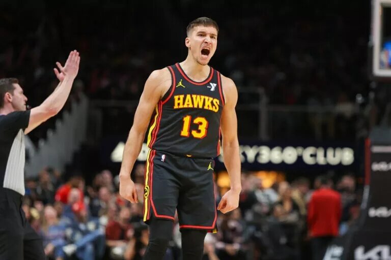 Dec 11, 2023; Atlanta, Georgia, USA; Atlanta Hawks guard Bogdan Bogdanovic (13) reacts after a basket against the Denver Nuggets in the second half at State Farm Arena. Mandatory Credit: Brett Davis-USA TODAY Sports