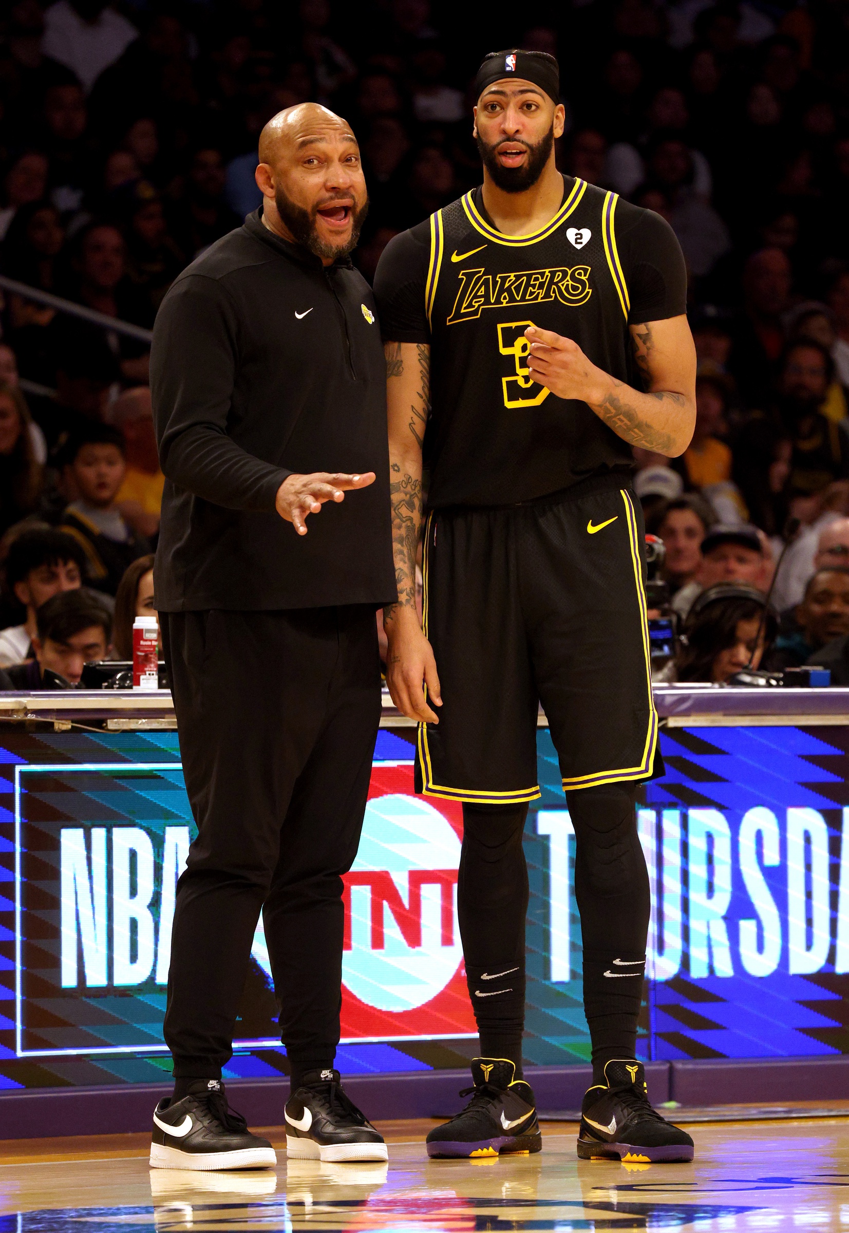 Los Angeles Lakers head coach Darvin Ham talks to forward Anthony Davis (3) during the fourth quarter against the Denver Nuggets at Crypto.com Arena.
