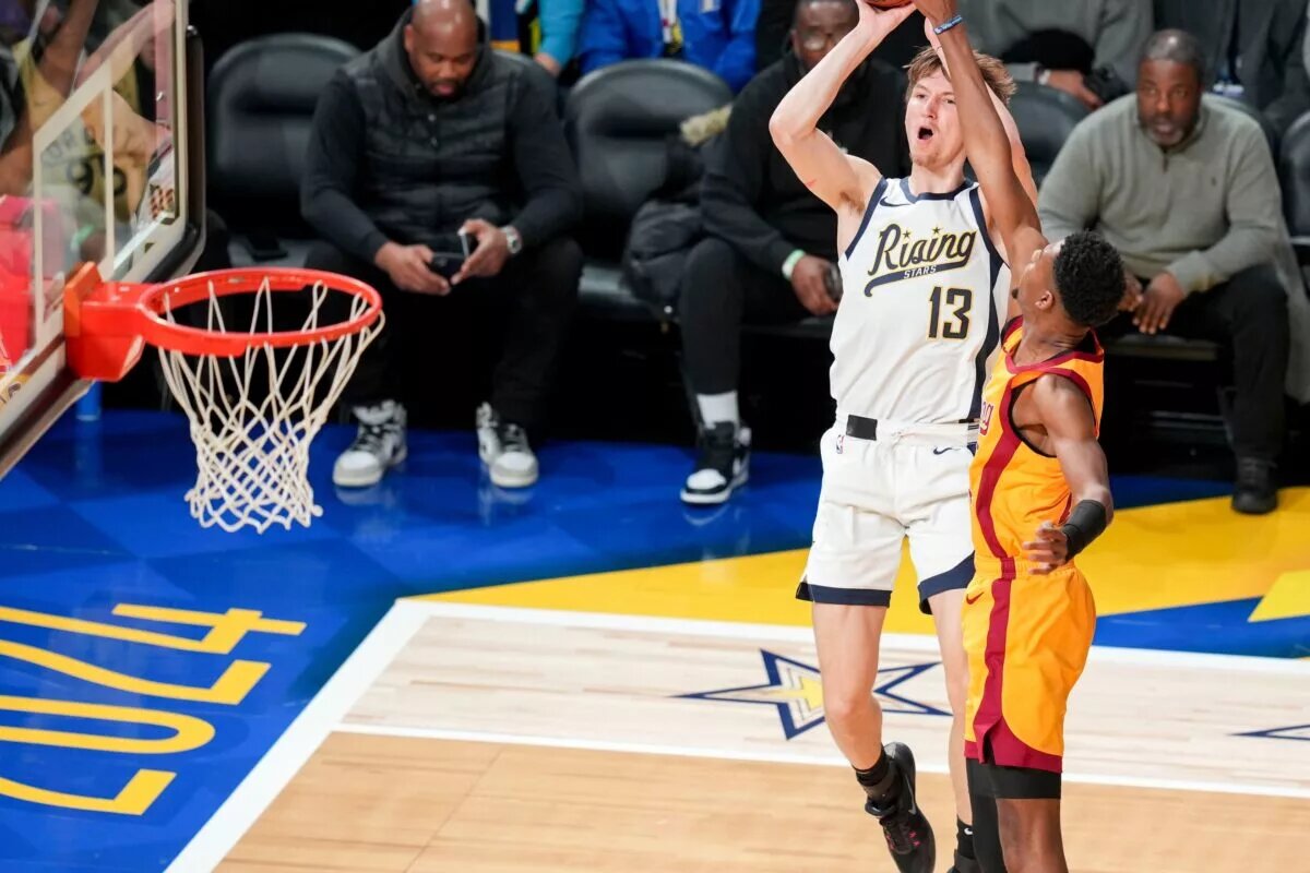 Team Detlef forward Matas Buzelis (13) of G League Ignite goes up for the game-winning shot over Team Pau forward Brandon Miller (24) of the Charlotte Hornets on Friday, Feb. 16, 2024, during the 2024 Panini Rising Stars Game at Gainbridge Fieldhouse in downtown Indianapolis.