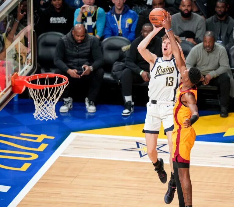 Team Detlef forward Matas Buzelis (13) of G League Ignite goes up for the game-winning shot over Team Pau forward Brandon Miller (24) of the Charlotte Hornets on Friday, Feb. 16, 2024, during the 2024 Panini Rising Stars Game at Gainbridge Fieldhouse in downtown Indianapolis.