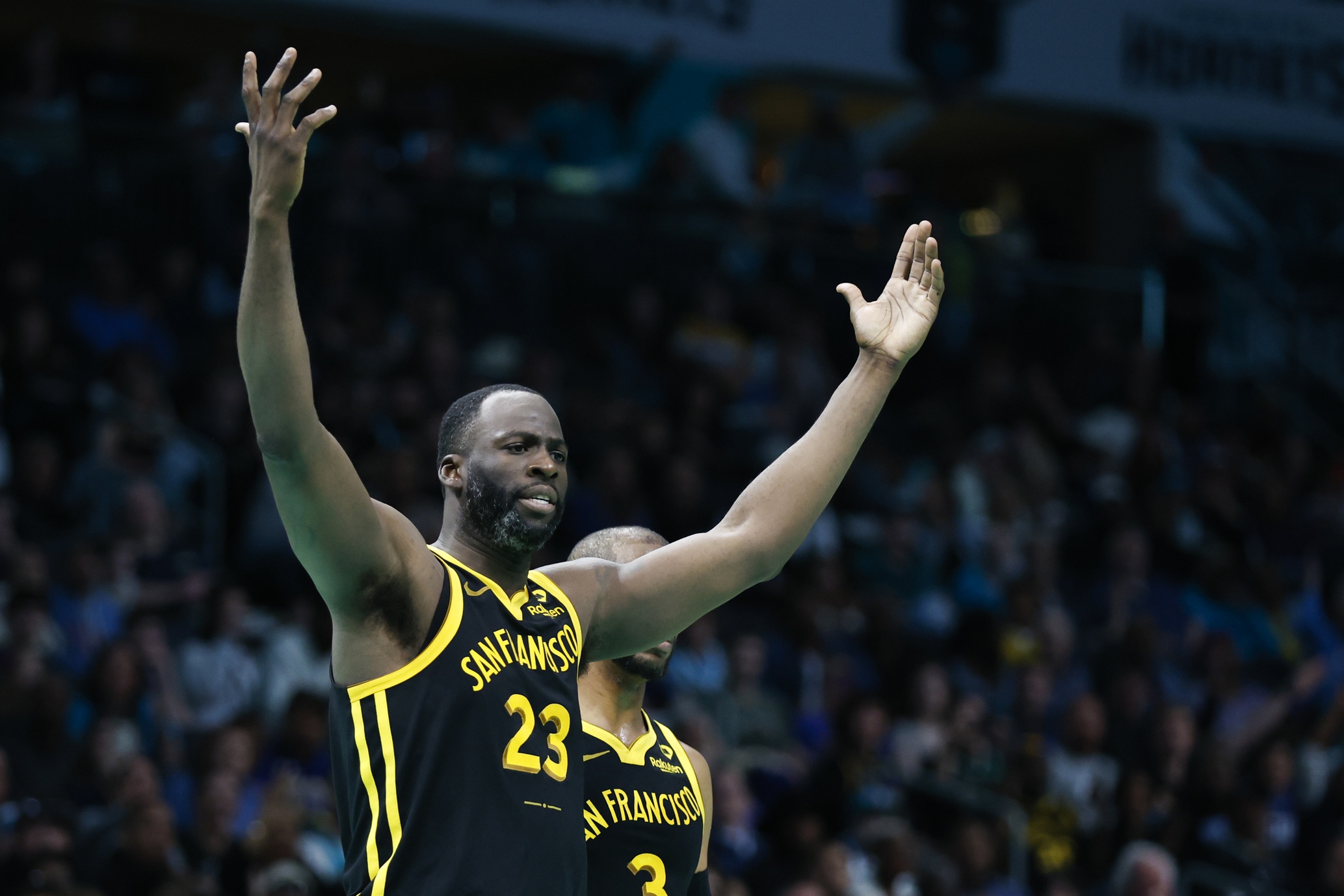 Mar 29, 2024; Charlotte, North Carolina, USA; Golden State Warriors forward Draymond Green (23) reacts after being charged with a foul in the second half as the Warriors play against the Charlotte Hornets at Spectrum Center. Mandatory Credit: Nell Redmond-USA TODAY Sports