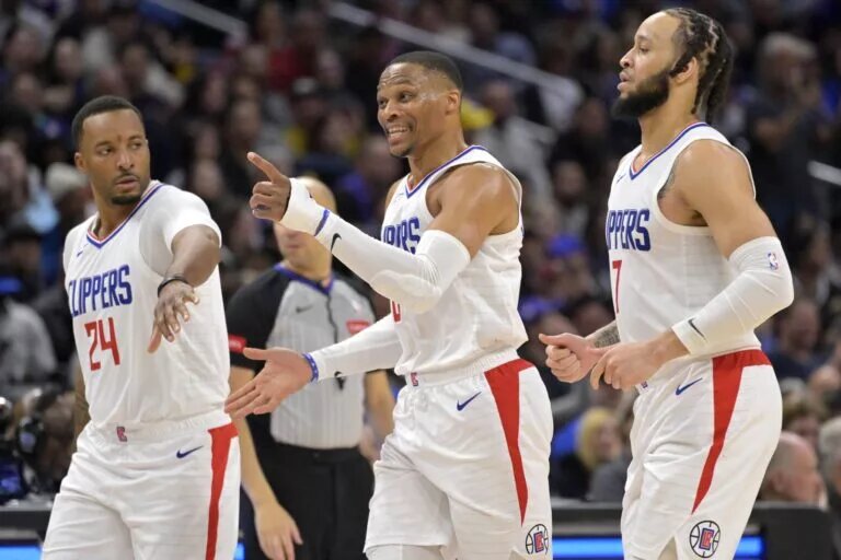 Apr 4, 2024; Los Angeles, California, USA; Los Angeles Clippers guard Russell Westbrook (0) celebrates with guard Norman Powell (24) and guard Amir Coffey (7) after a dunk in the second half against the Denver Nuggets at Crypto.com Arena. Mandatory Credit: Jayne Kamin-Oncea-USA TODAY Sports