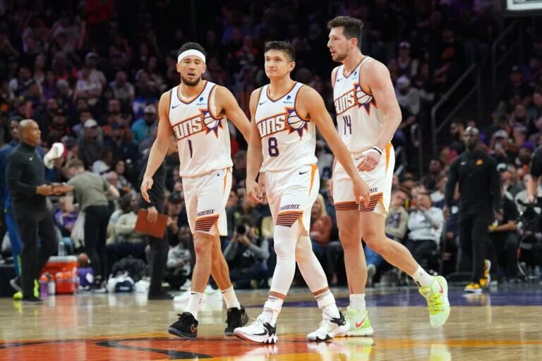 Apr 5, 2024; Phoenix, Arizona, USA; Phoenix Suns guard Devin Booker (1) and Phoenix Suns guard Grayson Allen (8) and Phoenix Suns forward Drew Eubanks (14) look on against the Minnesota Timberwolves during the second half at Footprint Center. Mandatory Credit: Joe Camporeale-USA TODAY Sports