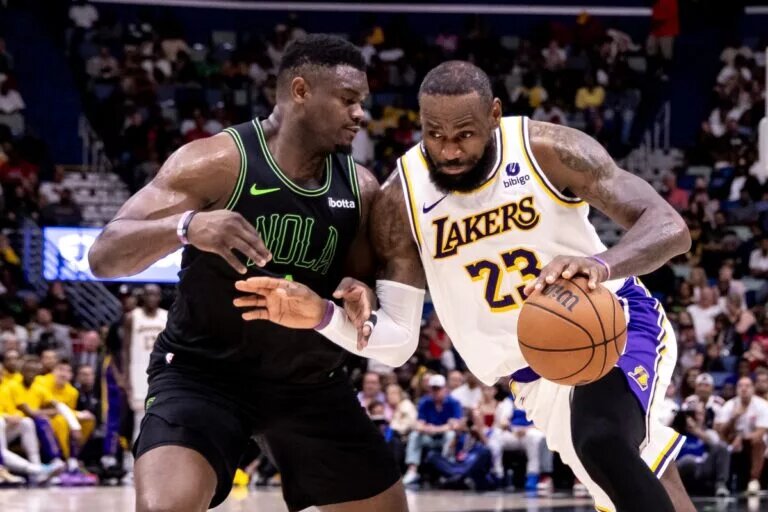 Apr 14, 2024; New Orleans, Louisiana, USA; Los Angeles Lakers forward LeBron James (23) dribbles against New Orleans Pelicans forward Zion Williamson (1) during the second half at Smoothie King Center. Mandatory Credit: Stephen Lew-USA TODAY Sports
