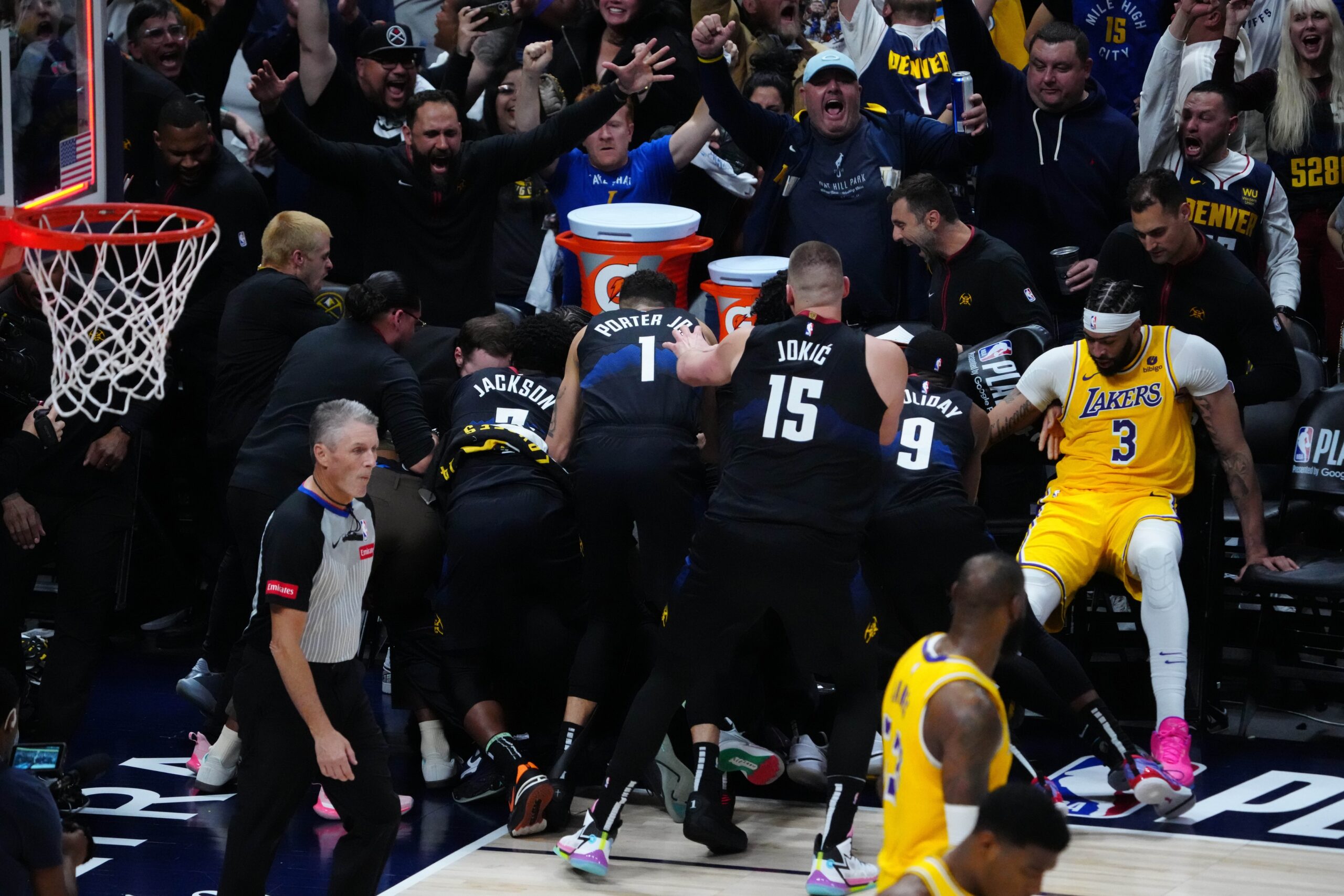 Members of the Denver Nuggets celebrate defeating the Los Angeles Lakers during game two during the 2024 NBA playoffs at Ball Arena.