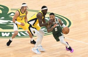 Milwaukee Bucks guard Damian Lillard (0) dribbles past Indiana Pacers forward Pascal Siakam (43) in the first half during game two of the first round for the 2024 NBA playoffs at Fiserv Forum.