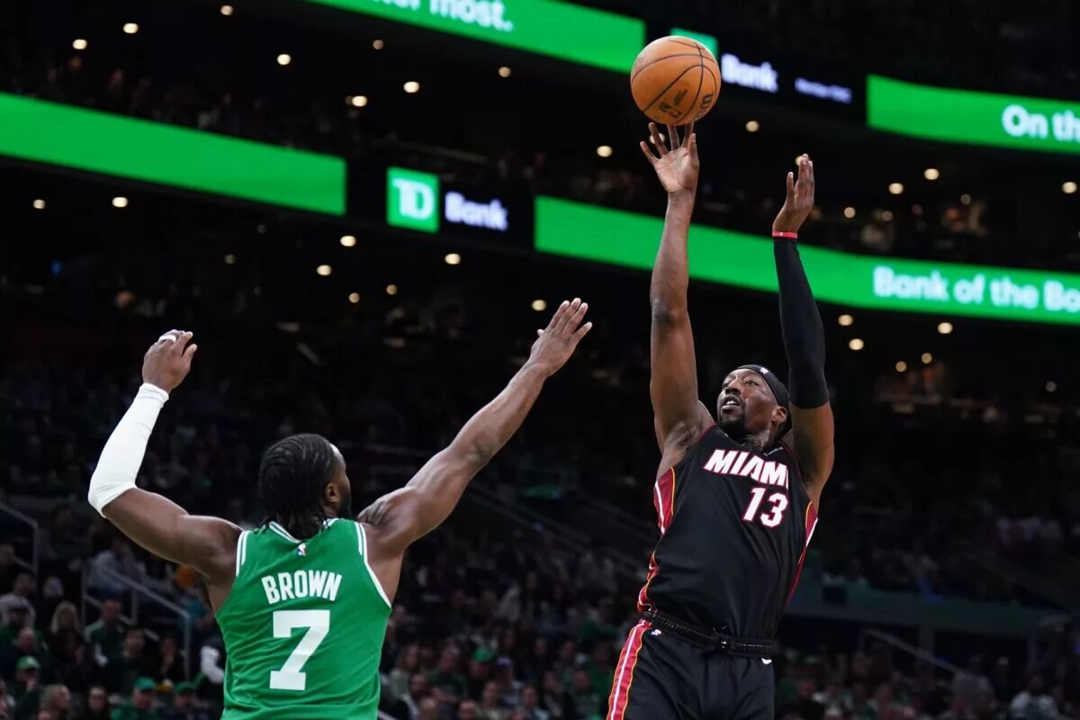 Apr 24, 2024; Boston, Massachusetts, USA; Miami Heat center Bam Adebayo (13) shoots against Boston Celtics guard Jaylen Brown (7) in the first quarter during game two of the first round for the 2024 NBA playoffs at TD Garden. Mandatory Credit: David Butler II-USA TODAY Sports