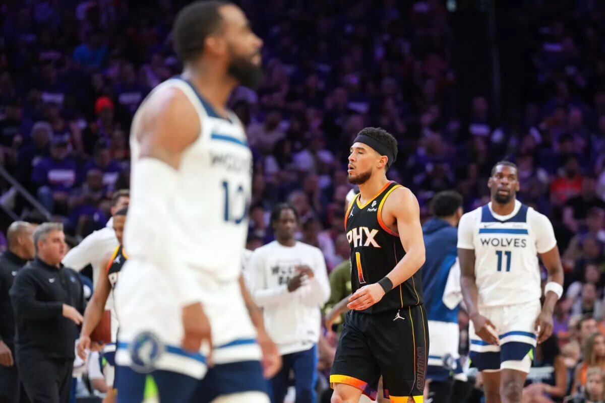 Phoenix Suns guard Devin Booker (1) reacts against the Minnesota Timberwolves during the second half of game three of the first round for the 2024 NBA playoffs at Footprint Center.