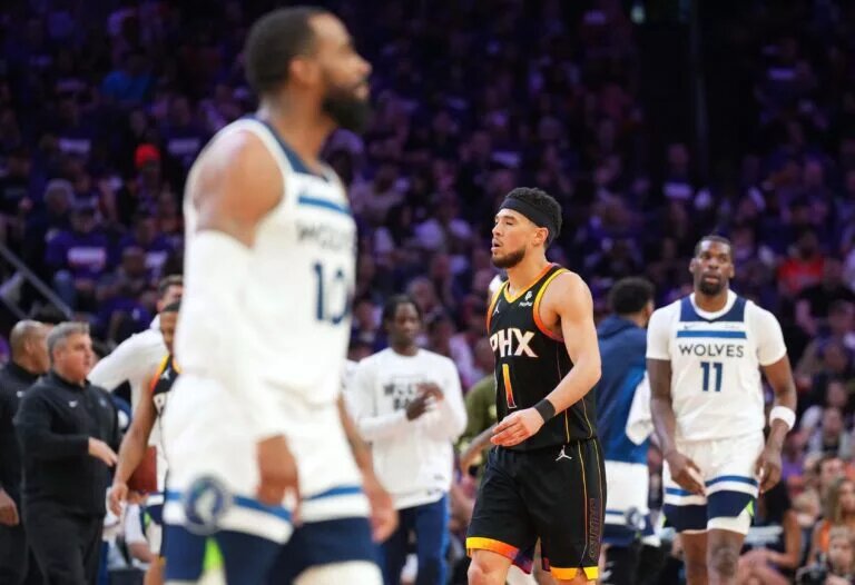 Phoenix Suns guard Devin Booker (1) reacts against the Minnesota Timberwolves during the second half of game three of the first round for the 2024 NBA playoffs at Footprint Center.
