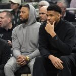 Milwaukee Bucks stars Damian Lillard and Giannis Antetokounmpo, out with injury during an elimination game