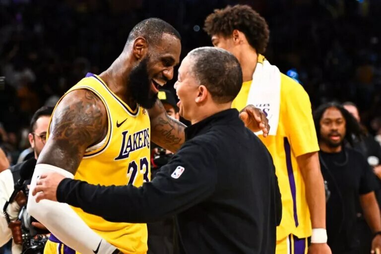 Los Angeles Lakers forward LeBron James and Los Angeles Clippers head coach Ty Lue embrace