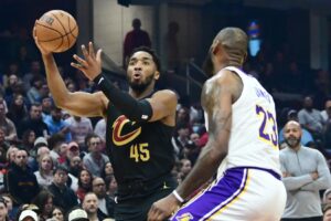 Cleveland Cavaliers guard Donovan Mitchell goes up for a shot against Los Angeles Lakers forward LeBron James