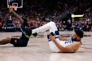 Minnesota Timberwolves big man Karl-Anthony Towns goes down with potential injury in Game of the 2024 NBA Playoffs