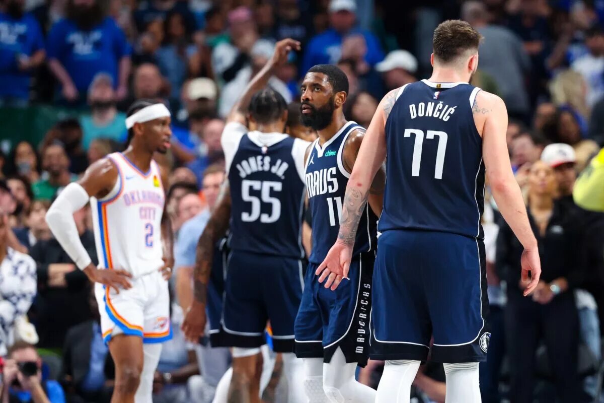 Dallas Mavericks guards Luka Doncic and Kyrie Irving in front of Oklahoma City Thunder guard Shai Gilgeous-Alexander
