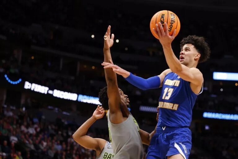 Mar 17, 2023; Denver, CO, USA; UC Santa Barbara Gauchos guard Ajay Mitchell (13) drives to the basket against Baylor Bears during the first half in the first round of the 2023 NCAA men’s basketball tournament at Ball Arena. Mandatory Credit: Michael Ciaglo-USA TODAY Sports
