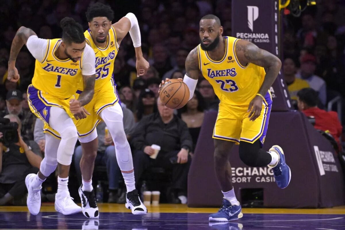 Dec 28, 2023; Los Angeles, California, USA; Los Angeles Lakers guard D'Angelo Russell (1) and forward Christian Wood (35) trail as forward LeBron James (23) takes the ball down court in the first half against the Charlotte Hornets at Crypto.com Arena. Mandatory Credit: Jayne Kamin-Oncea-USA TODAY Sports