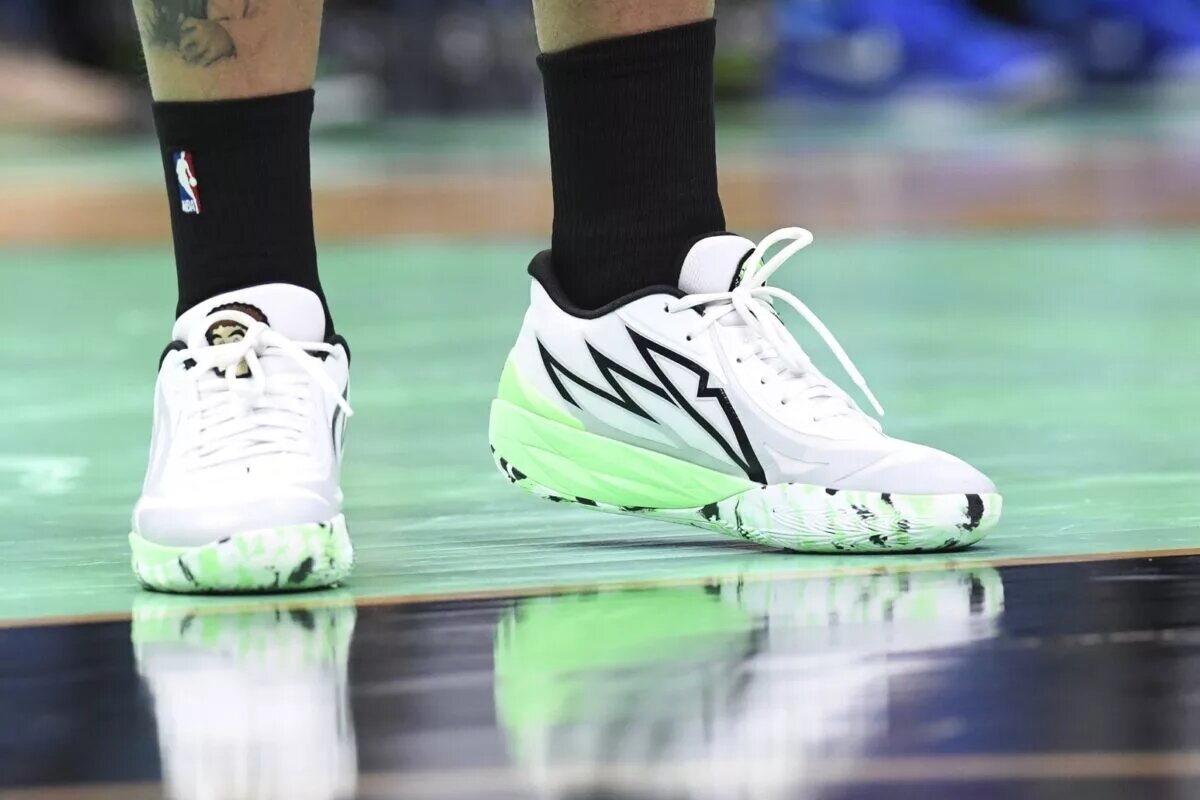 Apr 9, 2024; Charlotte, North Carolina, USA; A detailed look at the shoes of Charlotte Hornets forward Miles Bridges (0) during the second half against the Dallas Mavericks at the Spectrum Center. Mandatory Credit: Sam Sharpe-USA TODAY Sports