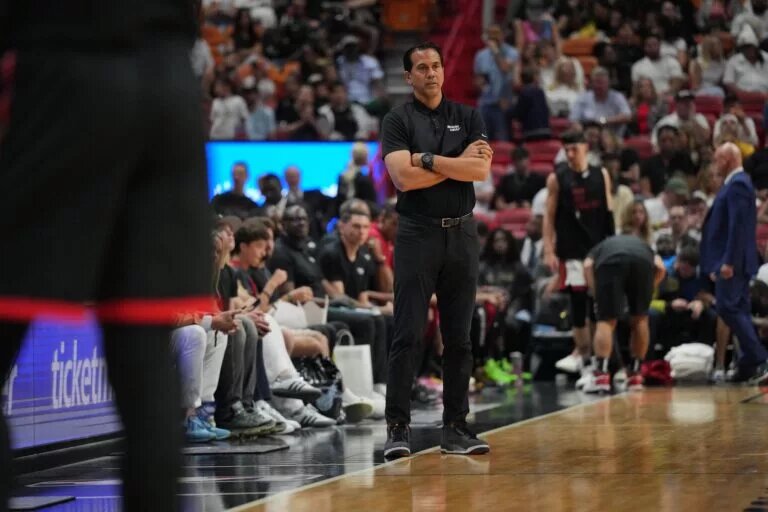 Apr 14, 2024; Miami, Florida, USA; Miami Heat head coach Erik Spoelstra keeps an eye on his team during the first half against the Toronto Raptors at Kaseya Center. Mandatory Credit: Jim Rassol-USA TODAY Sports