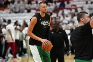 Boston Celtics center Kristaps Porzingis (8) warms-up before game three of the first round for the 2024 NBA playoffs against the Miami Heat at Kaseya Center.