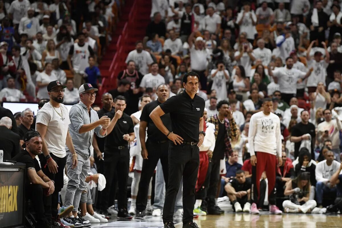 Apr 29, 2024; Miami, Florida, USA; Miami Heat coach Erik Spoelstra, center, watches the Boston Celtics pull ahead of the Heat during the second quarter of game four of the first round for the 2024 NBA playoffs at Kaseya Center. Mandatory Credit: Michael Laughlin-USA TODAY Sports