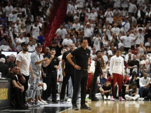 Apr 29, 2024; Miami, Florida, USA; Miami Heat coach Erik Spoelstra, center, watches the Boston Celtics pull ahead of the Heat during the second quarter of game four of the first round for the 2024 NBA playoffs at Kaseya Center. Mandatory Credit: Michael Laughlin-USA TODAY Sports