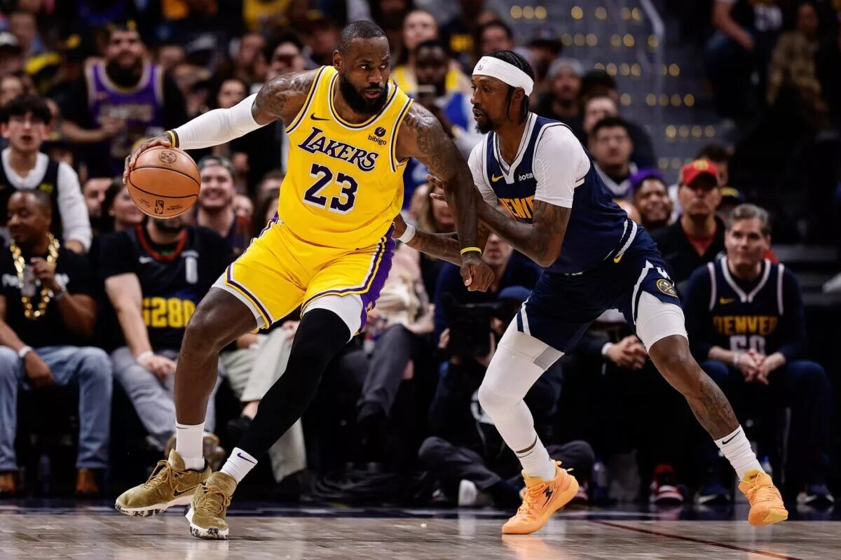 Apr 29, 2024; Denver, Colorado, USA; Los Angeles Lakers forward LeBron James (23) controls the ball as Denver Nuggets guard Kentavious Caldwell-Pope (5) guards in the third quarter during game five of the first round for the 2024 NBA playoffs at Ball Arena. Mandatory Credit: Isaiah J. Downing-USA TODAY Sports