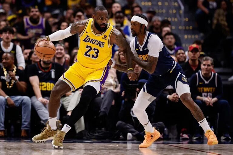Apr 29, 2024; Denver, Colorado, USA; Los Angeles Lakers forward LeBron James (23) controls the ball as Denver Nuggets guard Kentavious Caldwell-Pope (5) guards in the third quarter during game five of the first round for the 2024 NBA playoffs at Ball Arena. Mandatory Credit: Isaiah J. Downing-USA TODAY Sports
