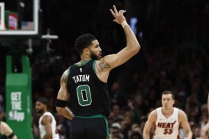 Boston Celtics forward Jayson Tatum (0) celebrates a three point basket against the Miami Heat during the first quarter of game five of the first round of the 2024 NBA playoffs at TD Garden.