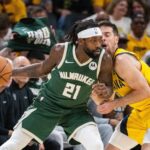 May 2, 2024; Indianapolis, Indiana, USA; Milwaukee Bucks guard Patrick Beverley (21) dribbles the ball while Indiana Pacers guard T.J. McConnell (9) defends during game six of the first round for the 2024 NBA playoffs at Gainbridge Fieldhouse. Mandatory Credit: Trevor Ruszkowski-USA TODAY Sports